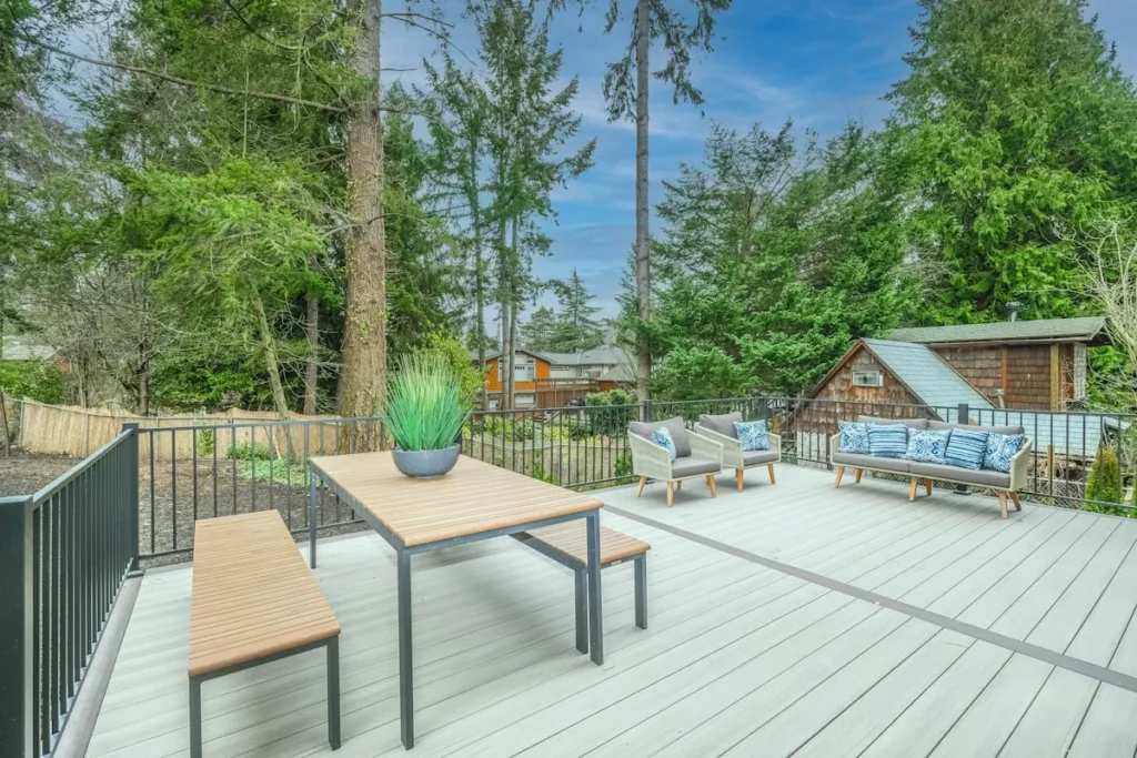 Brown wooden table and chairs on a backyard deck in Dade City FL