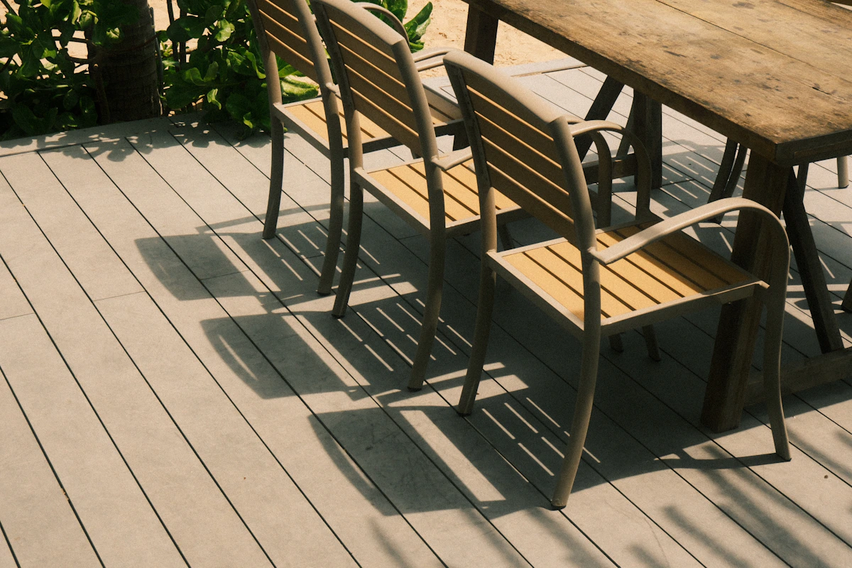 Three chairs and a table on a wooden deck in Odessa FL Three chairs and a table on a wooden deck in Odessa FL