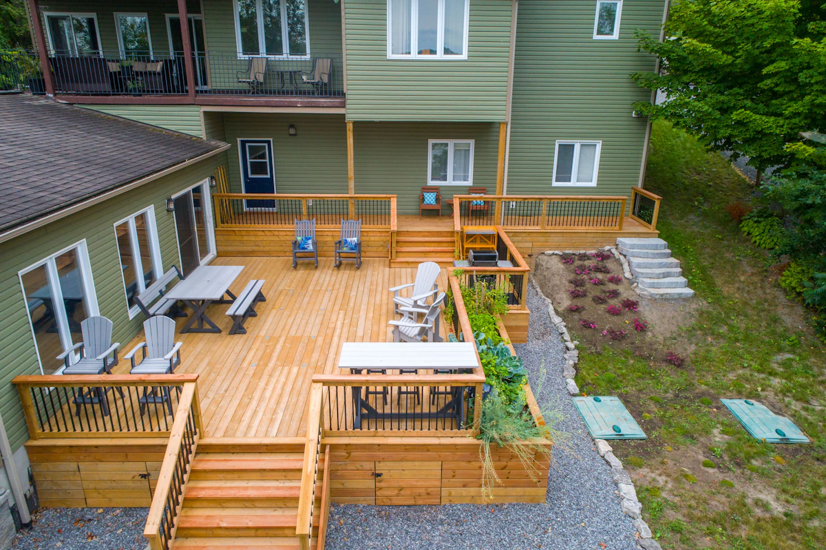 Composite Deck with Outdoor Chairs next to House in Wesley Chapel FL Composite deck with chairs and tables next to a house in Wesley Chapel FL